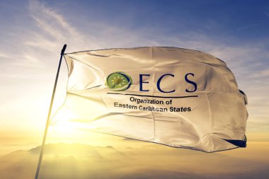 Organisation of Eastern Caribbean States OECS flag textile cloth fabric waving on the top sunrise mist fog clipart