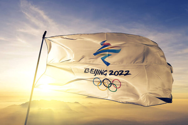 2022 Winter Olympics Beijing logo flag textile cloth fabric waving on the top sunrise mist fog