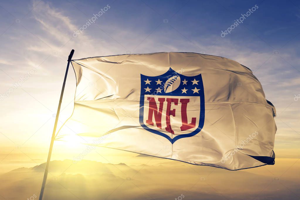 NFL National Football League logo flag textile cloth fabric waving on the top sunrise mist fog