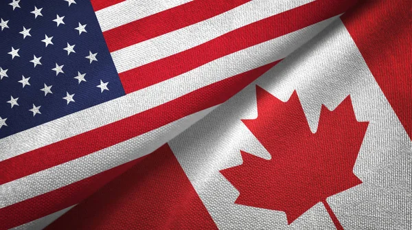 United States and Canada flags together textile cloth, fabric texture