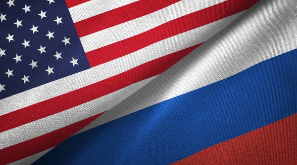 United States and Russia flags together textile cloth, fabric texture
