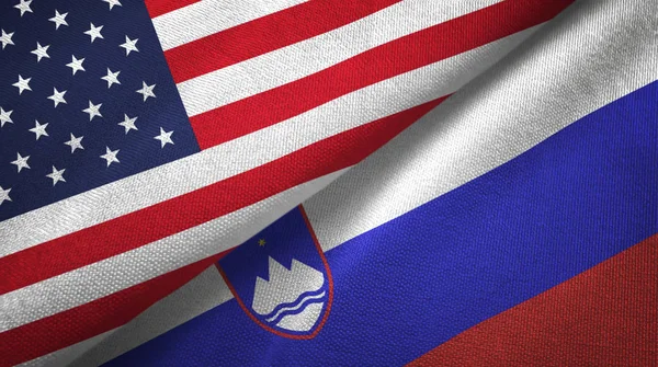 United States and Slovenia flags together textile cloth, fabric texture