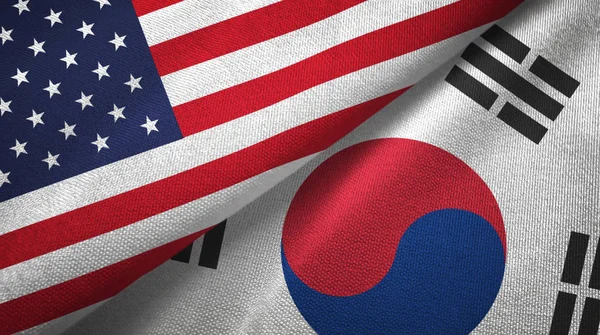 United States and South Korea flags together textile cloth, fabric texture