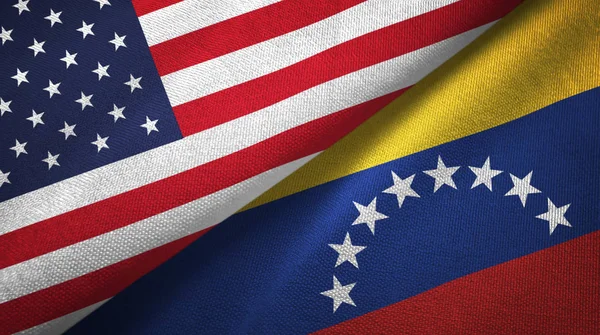 United States and Venezuela flags together textile cloth, fabric texture