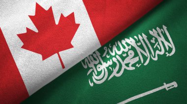 Kanada ve Suudi Arabistan bayrakları tekstil kumaş, kumaş dokusu. Metin Suudi Arabistan bayrağı anlamına gelir - hiçbir Tanrı ancak Allah, Muhammed Allah'ın Messenger olduğunu