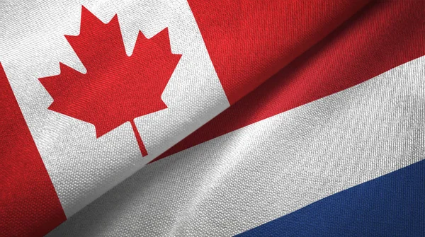 Canada and Netherlands flags together relations textile cloth, fabric texture