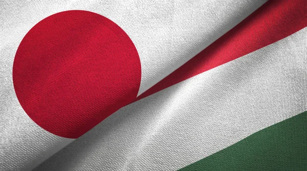 Japonya ve Macaristan bayrakları birlikte tekstil kumaş, kumaş doku