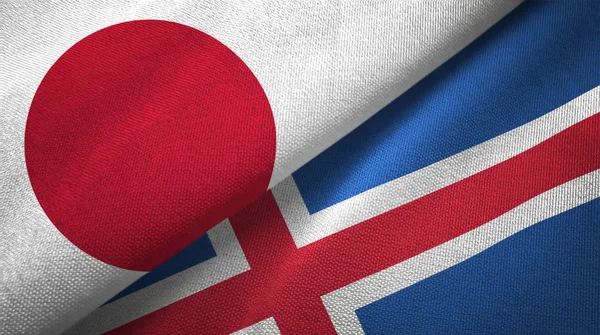Japan and Iceland flags together textile cloth, fabric texture