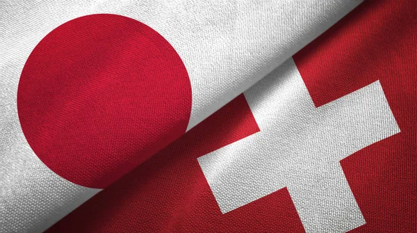 Japan and Switzerland flags together textile cloth, fabric texture