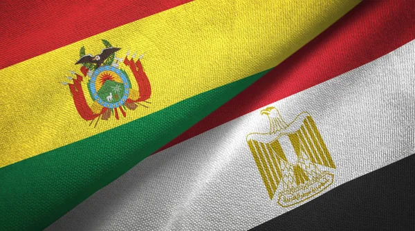 Bolivia and Egypt flags together relations textile cloth, fabric texture. Text on egyptian flag means - Arab Republic of Egypt