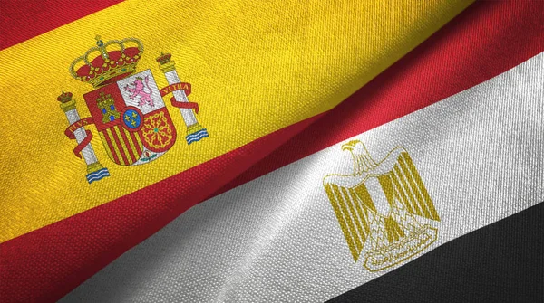 Spain and Egypt flags together relations textile cloth, fabric texture. Text on egyptian flag means - Arab Republic of Egypt