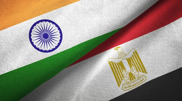 India and Egypt flags together relations textile cloth, fabric texture. Text on egyptian flag means - Arab Republic of Egypt