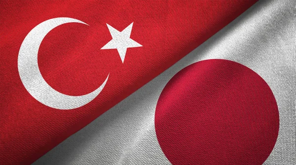 Turkey and Japan flags together textile cloth, fabric texture