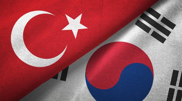 Turkey and South Korea flags together textile cloth, fabric texture