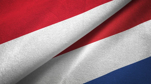 印度尼西亚和荷兰国旗一起纺织布 织物纹理 — 图库照片