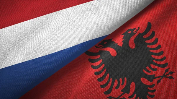 Niederlande Und Albanien Flaggen Zusammen Beziehungen Textiltuch Textilstruktur — Stockfoto