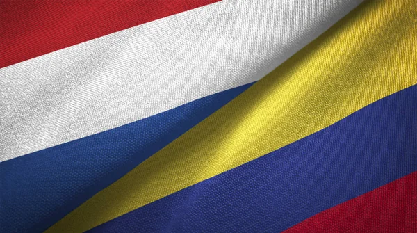荷兰和哥伦比亚国旗一起关系纺织布 织物纹理 — 图库照片