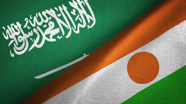 Saudi Arabia and Niger flags. Text on saudi arabian flag means - There is no god but God, Muhammad is the Messenger of God