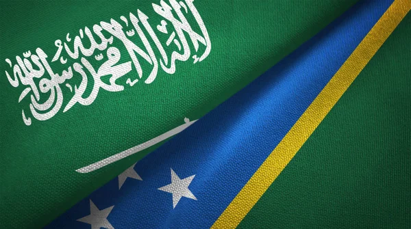 Saudi Arabia and Solomon Islands flags. Text on saudi arabian flag means - There is no god but God, Muhammad is the Messenger of God