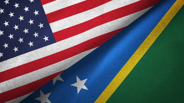 United States and Solomon Islands two folded flags together
