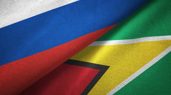 Rusland Guyana Twee Gevouwen Vlaggen Samen — Stockfoto