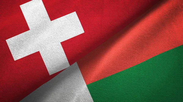 Switzerland and Madagascar two folded flags together