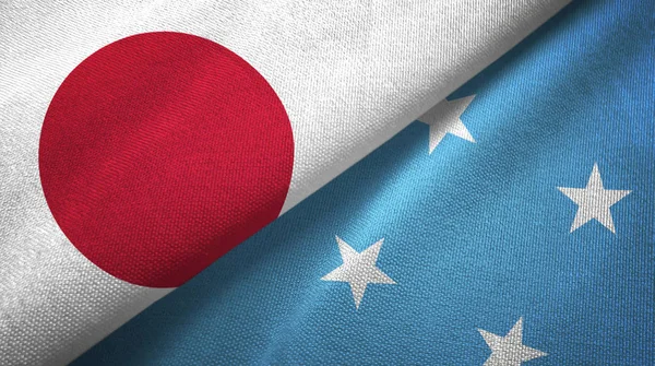 Japan and Micronesia two folded flags together