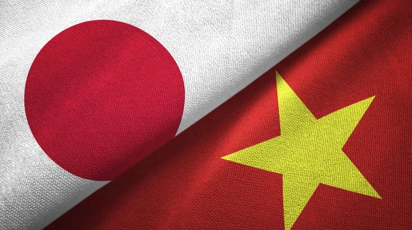 Japan and Vietnam two folded flags together