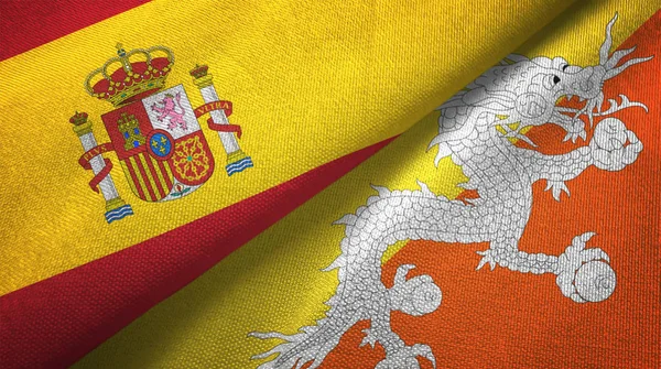 西班牙和不丹将两面折叠的国旗放在一起 — 图库照片