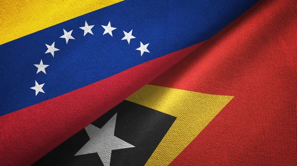Venezuela und timor-leste east timor zwei flaggen textilstoff, textur — Stockfoto