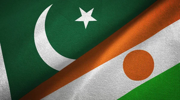 Pákistán a Niger dvě vlajky textilní tkaniny, textura textilií — Stock fotografie