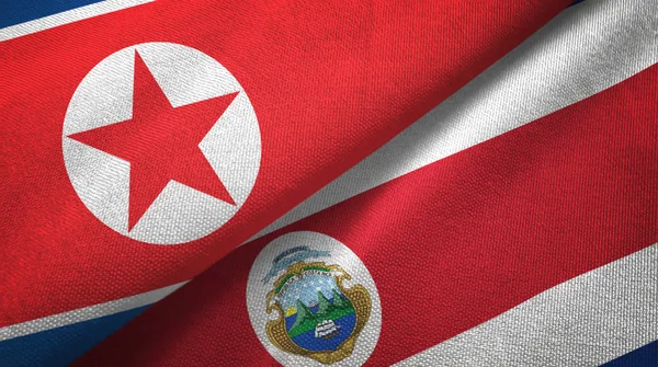North Korea and Costa Rica two flags textile cloth, fabric texture — Stock Photo, Image