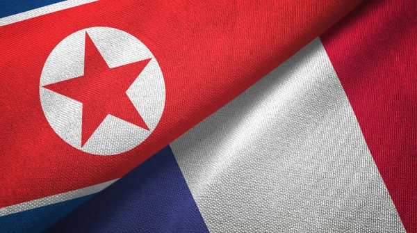 North Korea and France two flags textile cloth, fabric texture — Stock Photo, Image