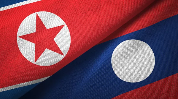 North Korea and Laos two flags textile cloth. — Stock Photo, Image