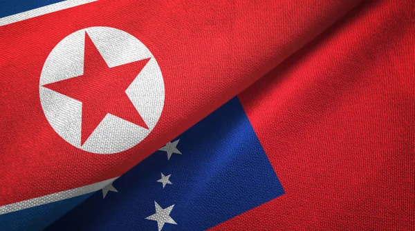 Noord-Korea en Samoa twee vlaggen textieldoek, weefsel textuur — Stockfoto