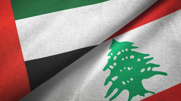 Förenade Arabemiraten och Libanon två flaggor textil duk, tyg konsistens — Stockfoto