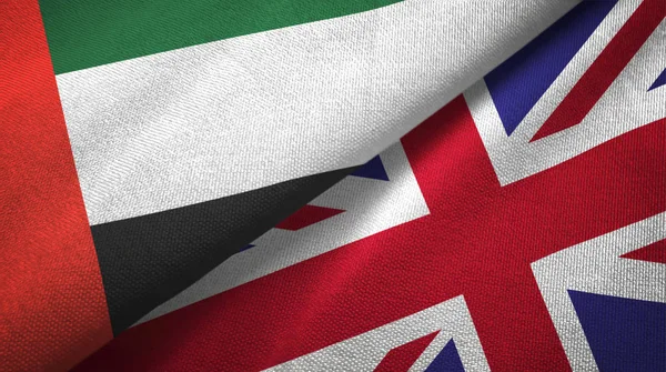 アラブ首長国連邦とイギリス2つのフラグテキスタイルクロス、ファブリックテクスチャ — ストック写真
