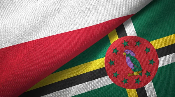 Polen en Dominica twee vlaggen textieldoek, weefsel textuur — Stockfoto
