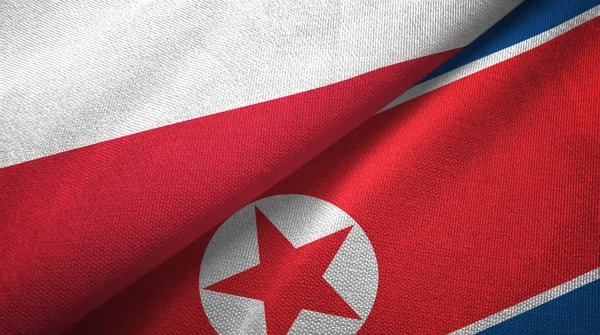 Polen en Noord-Korea twee vlaggen textieldoek, weefsel textuur — Stockfoto