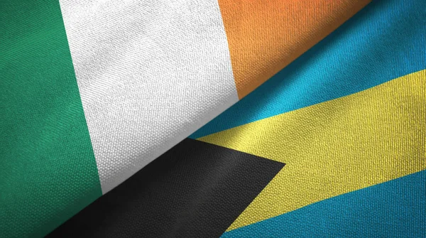 Irlanda e Bahamas due bandiere tessuto, tessitura tessuto — Foto Stock