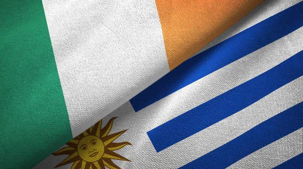 Irland und uruguay zwei flaggen textiltuch, textur — Stockfoto