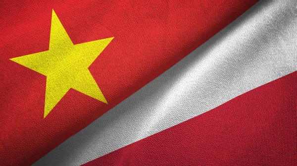 Vietnam ve Polonya iki bayraklar tekstil kumaş, kumaş doku — Stok fotoğraf