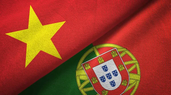 Vietnam and Portugal two flags textile cloth, fabric texture — Stock Photo, Image