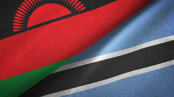 Malawi e Botswana due bandiere tessuto, tessitura del tessuto — Foto Stock