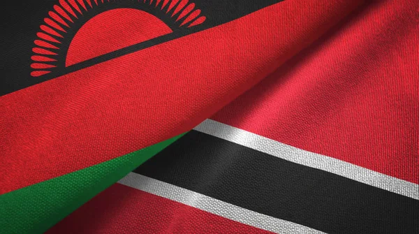 Malawi a Trinidad a Tobago dvě vlajky textilní tkaniny, textura textilií — Stock fotografie