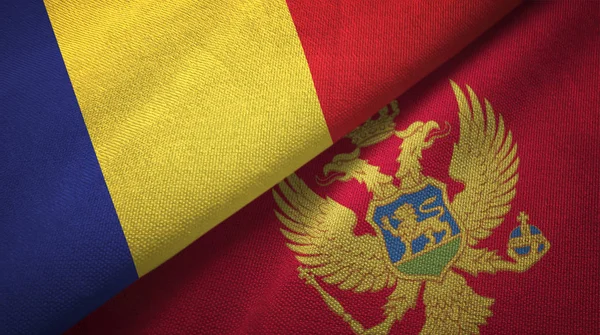 Roménia e Montenegro duas bandeiras de pano têxtil, textura de tecido — Fotografia de Stock