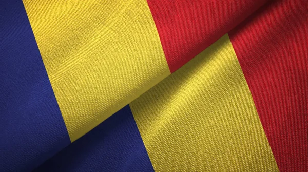 Roemenië twee vlaggen textiel doek, stof textuur — Stockfoto
