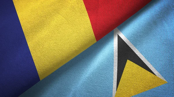 Románia és Saint Lucia két zászló textil ruhával, szövet textúra — Stock Fotó