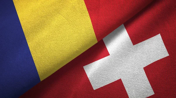 Rumänien och Schweiz två flaggor textil tyg, tyg konsistens — Stockfoto