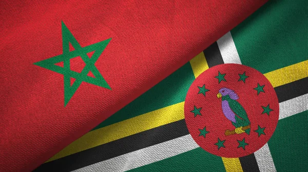 Marokko en Dominica twee vlaggen textiel doek, weefsel textuur — Stockfoto
